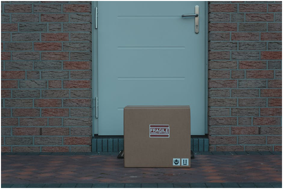 The outside view of a home’s door with a package placed in front of it